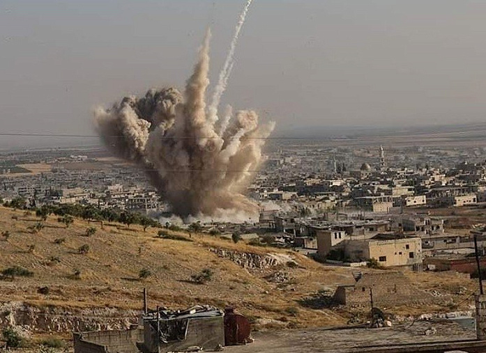 Syrian artillery hit bases of militants who attacked a Homs school  